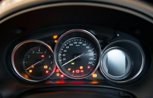 Car dashboard showing all warning lights